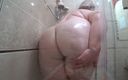 Milf big tits: The camera is watching a mature chubby milf in the...